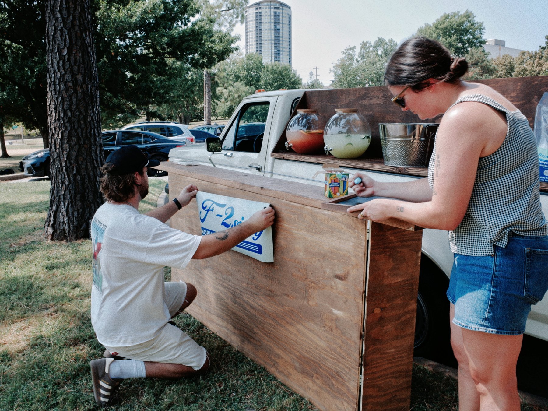 Hanging the F-2 Sippy sign on the truck bar